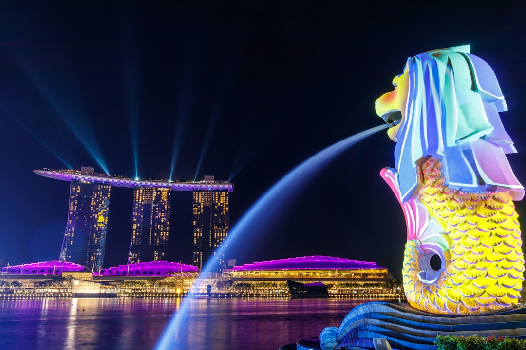 Lights shone on the Merlion as it overlooks Singapores iconic Marina Bay Sands. During the Formula 1 Grand Prix night race, lights were projected onto the Merlion and the boat of Marina Bay Sands.